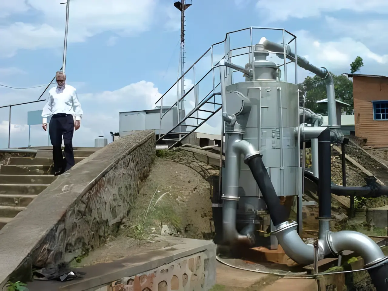 Person near pipes and machinery