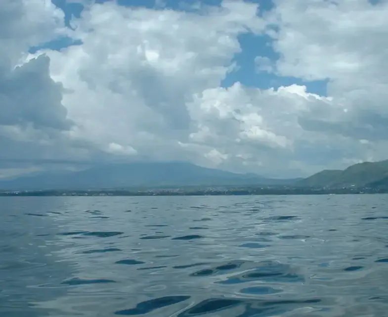 Rippling lake with distant mountains