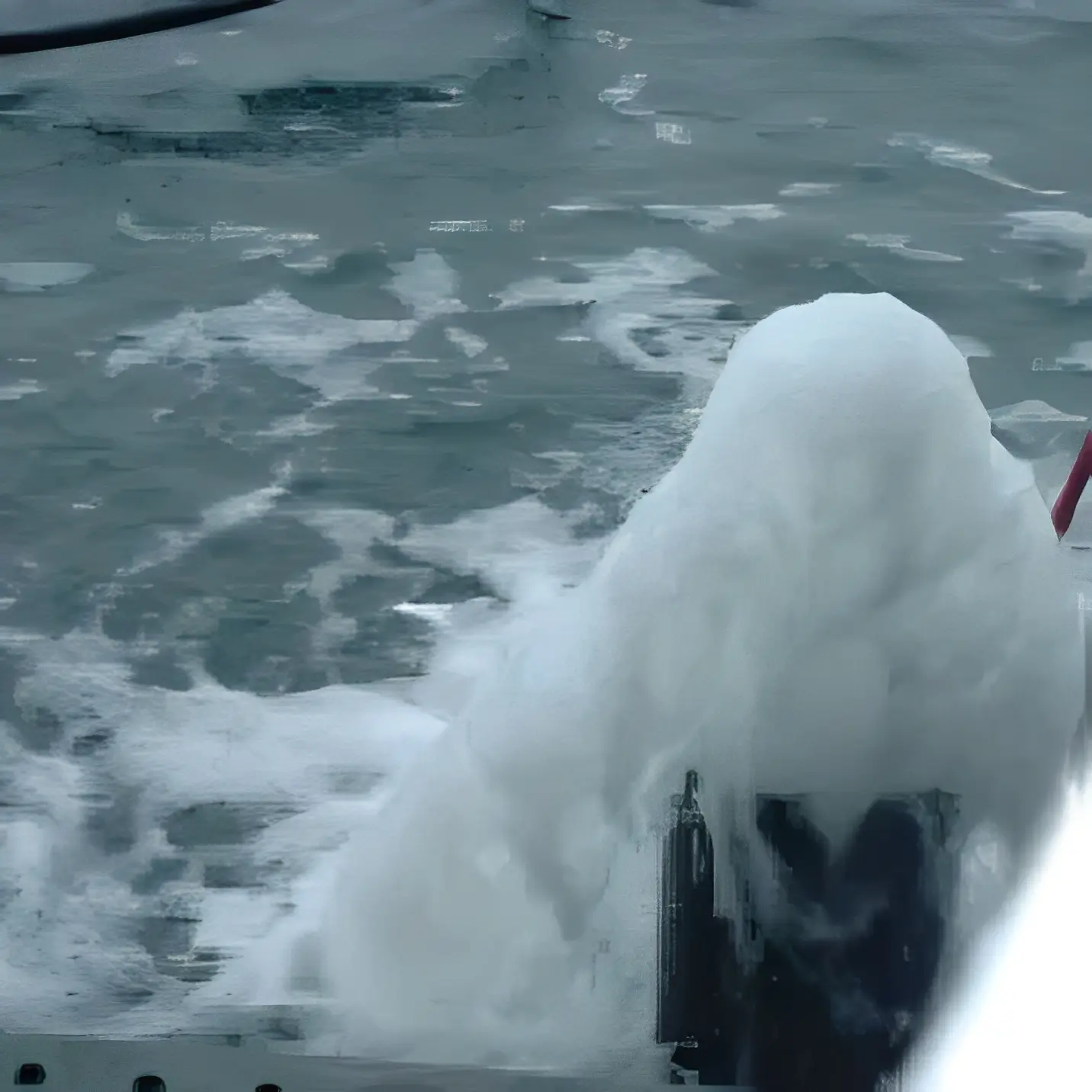 Snowy boat in cold water
