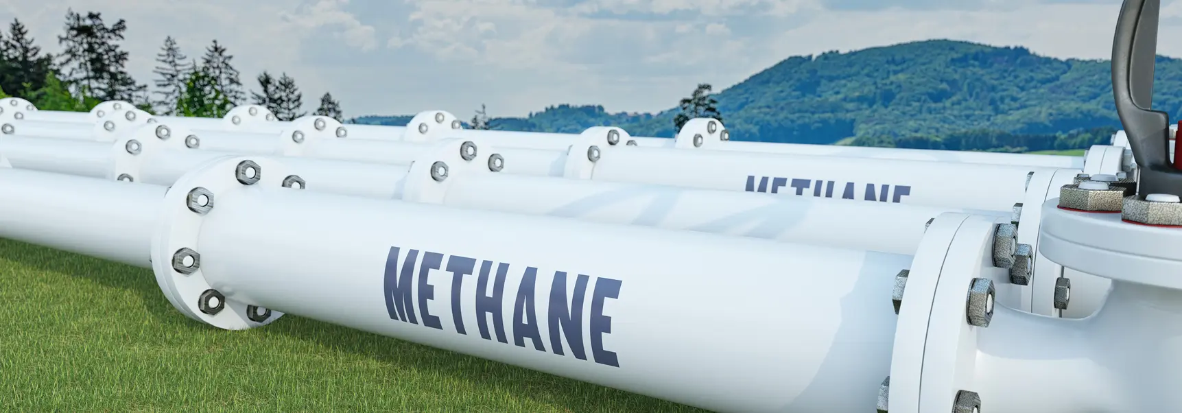 White methane pipes in a field