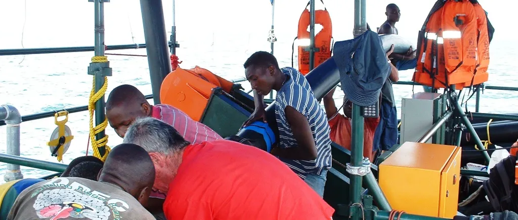 Scientists conducting marine research on vessel
